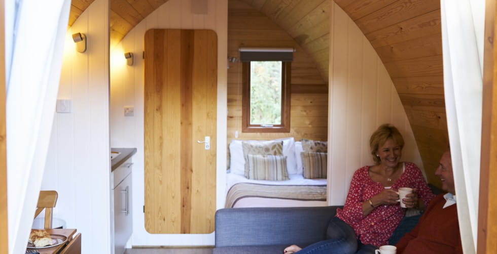 Couple inside a Whitemead Forest Park glamping pod