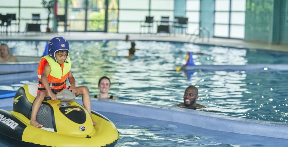 Family using the pool at Whitemead Forest Park