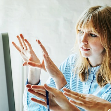 Woman sharing her screen with a colleague