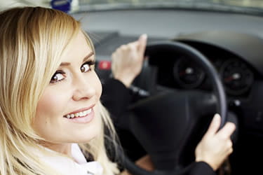 Blonde woman in car