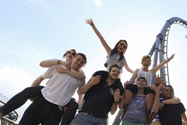 Friends outside a rollercoaster