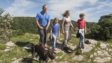 family walking in cheddar gorge