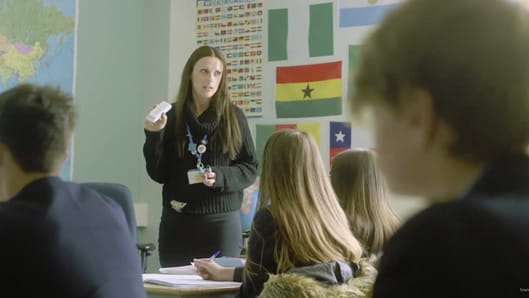 Teacher talking to students