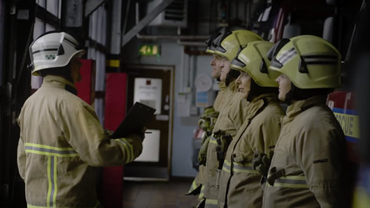 Firemen listening to a briefing