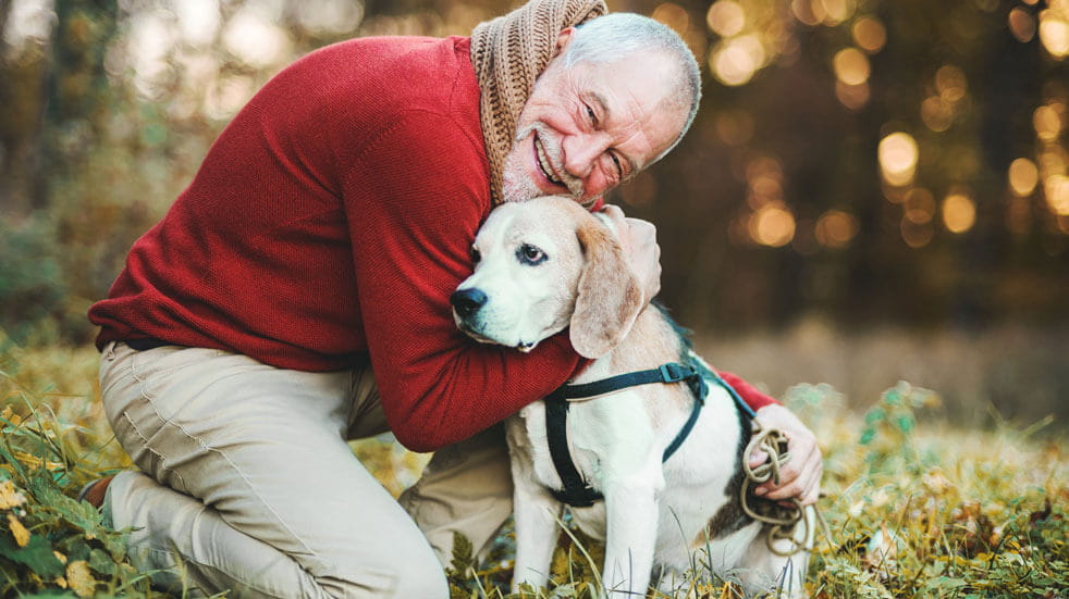 Why having pets at home could change your life; old man cuddling dog