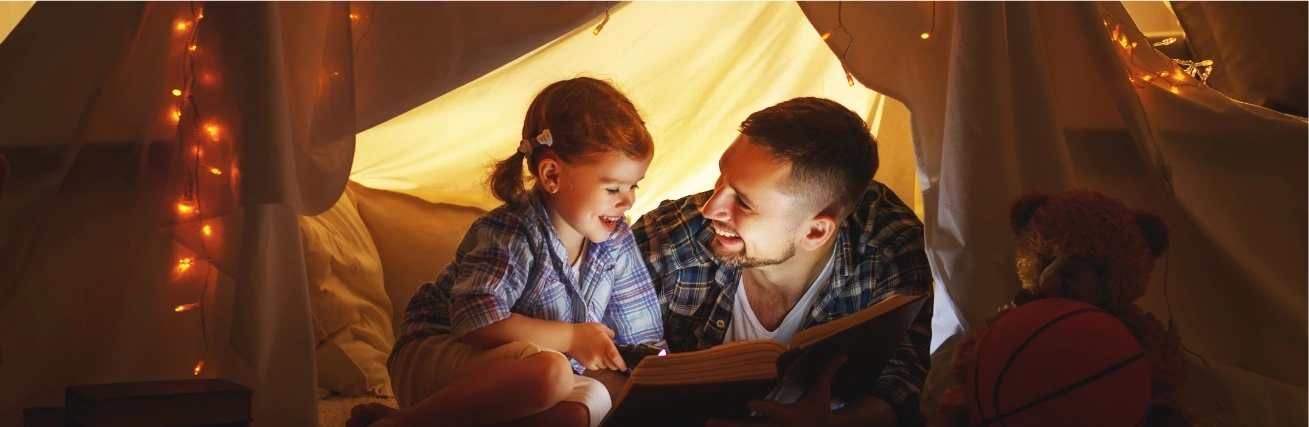 Father and child in a tent