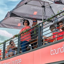 Couple watching an event from the Boundless hospitality truck